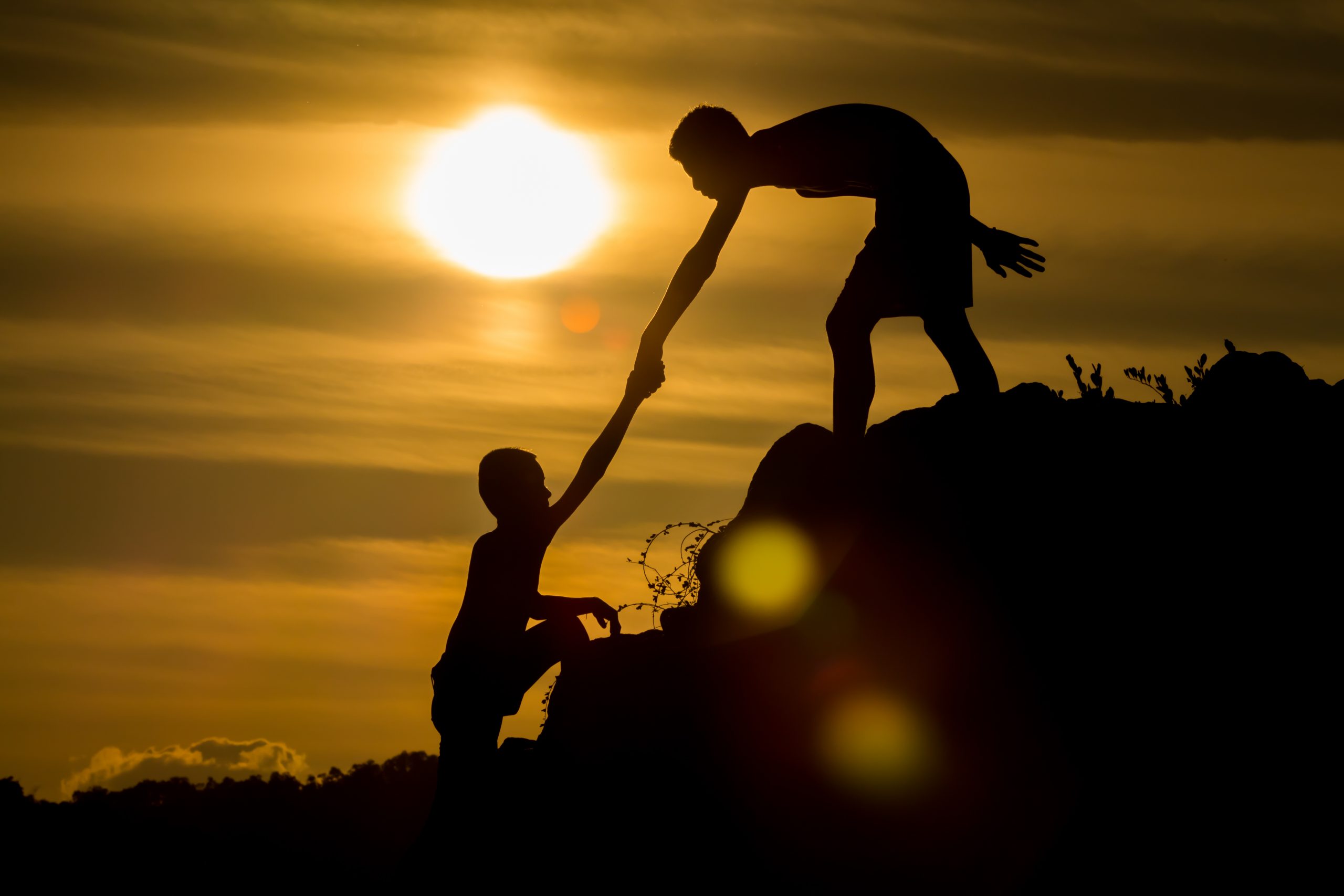 Silhouette Of  Helping Hand Of A Friend.